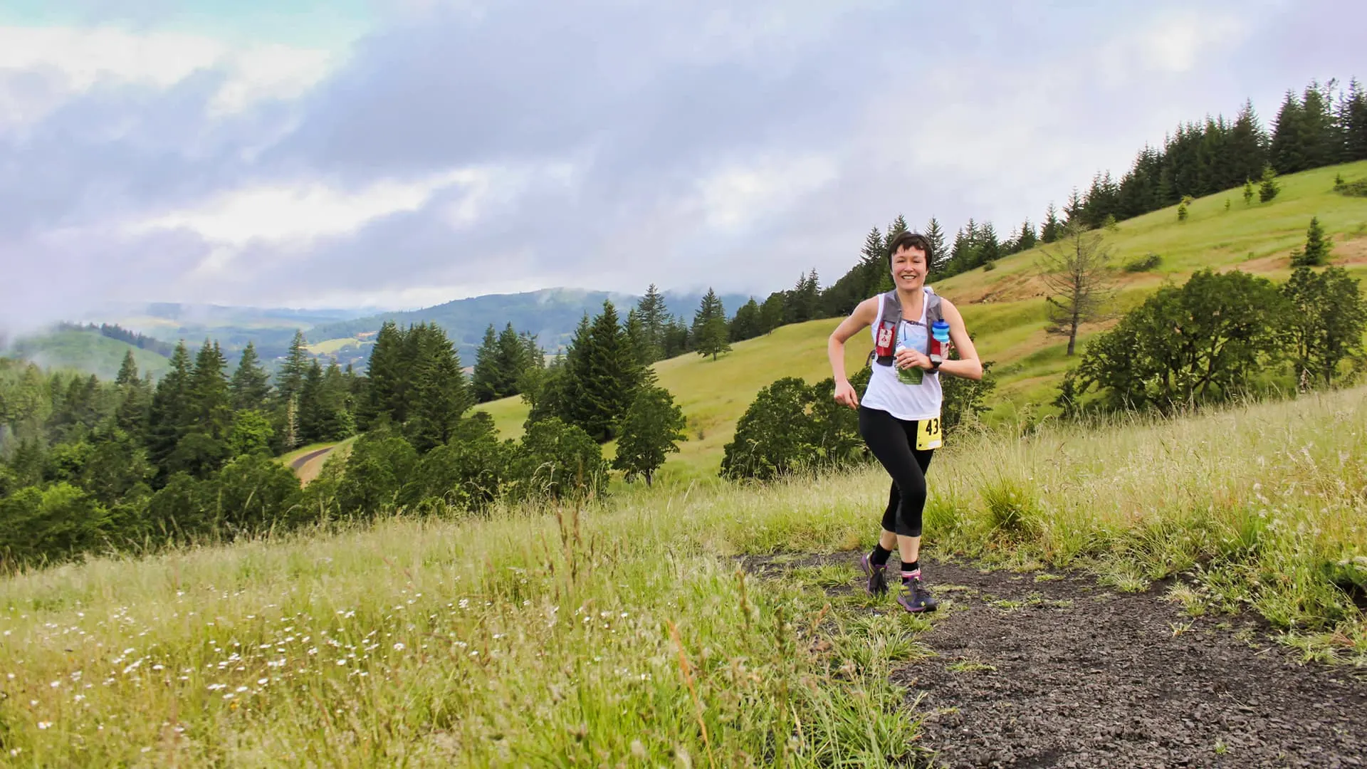 Trail runners at scenic overlook