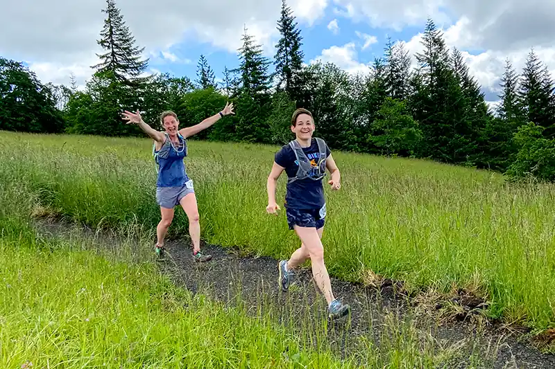 Two runners enjoying race while on Fitton Green