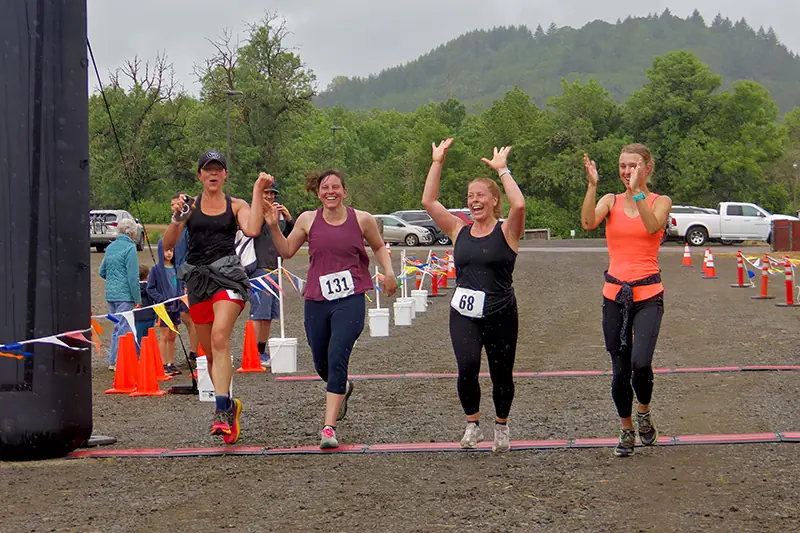 Two runners enjoying race while on Fitton Green