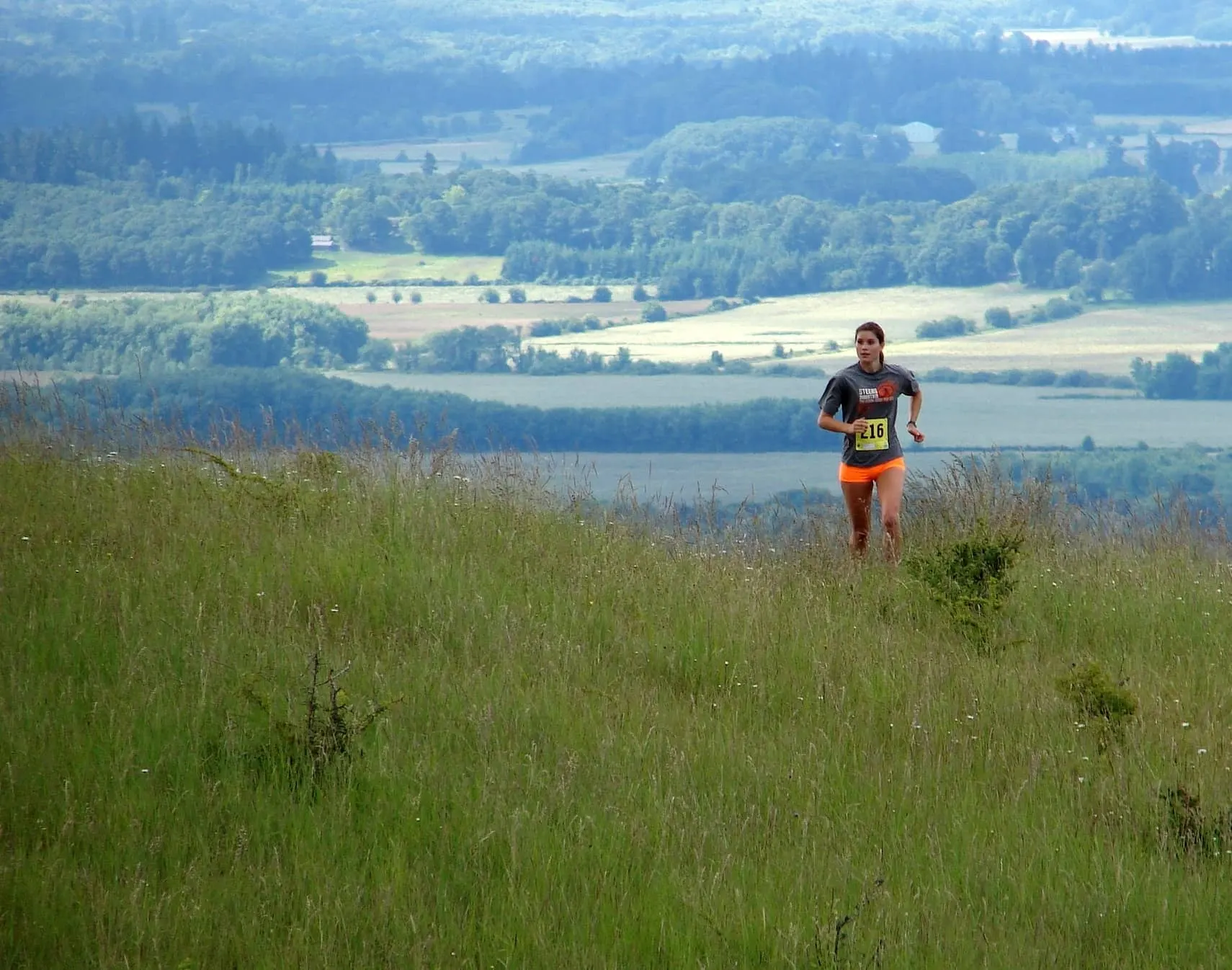 Trail runners on scenic mountain path